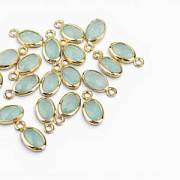 Подвеска металл "Эллипс", позолота/св.аквамарин, 9x4.5x2 мм